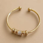 Lustrous Gold Charm Cuff Bracelet